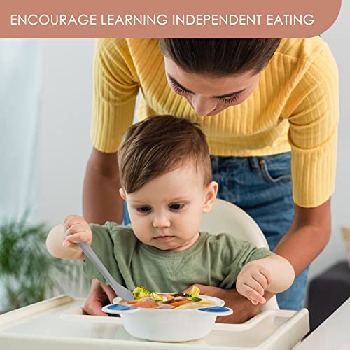 Baby holding bendable silicone spoon showing easy grip design