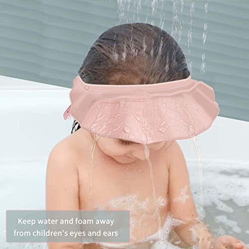 Child wearing KOMIDK pink shower cap during bath showing water protection