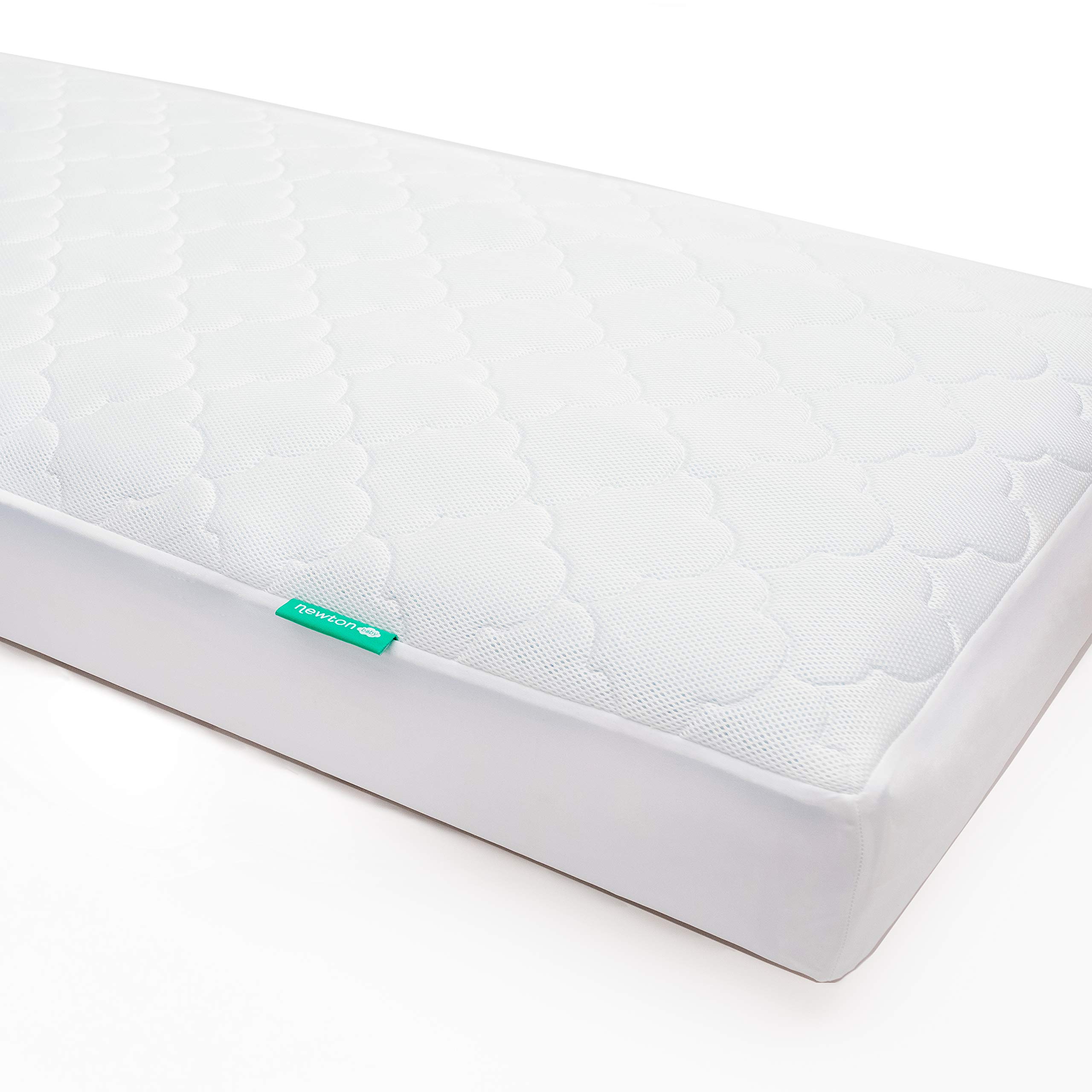 Newton Baby waterproof crib mattress pad showing quilted breathable surface