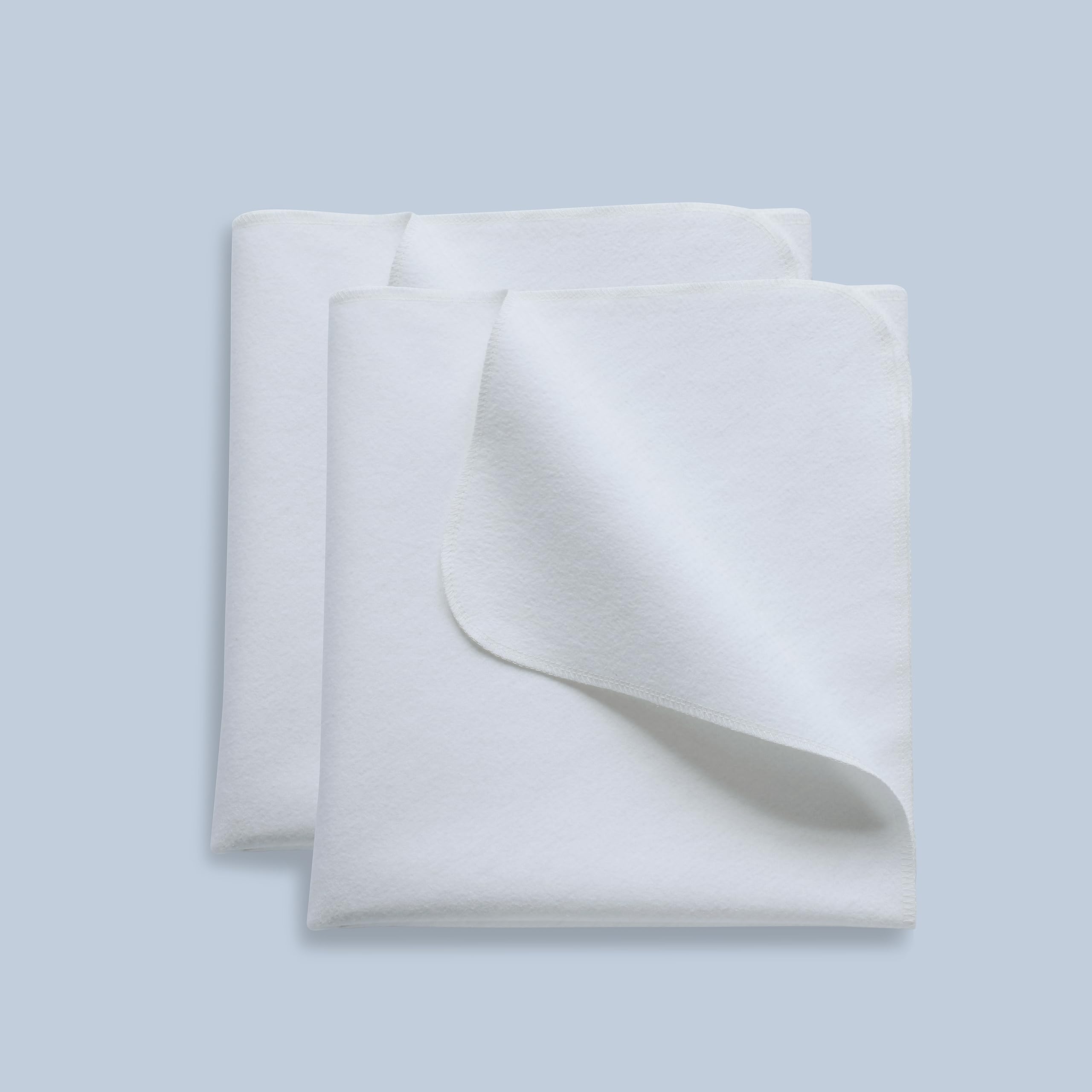 Shunjie.Home 2 Pack Waterproof Crib Pad showing the flannel surface and layered construction