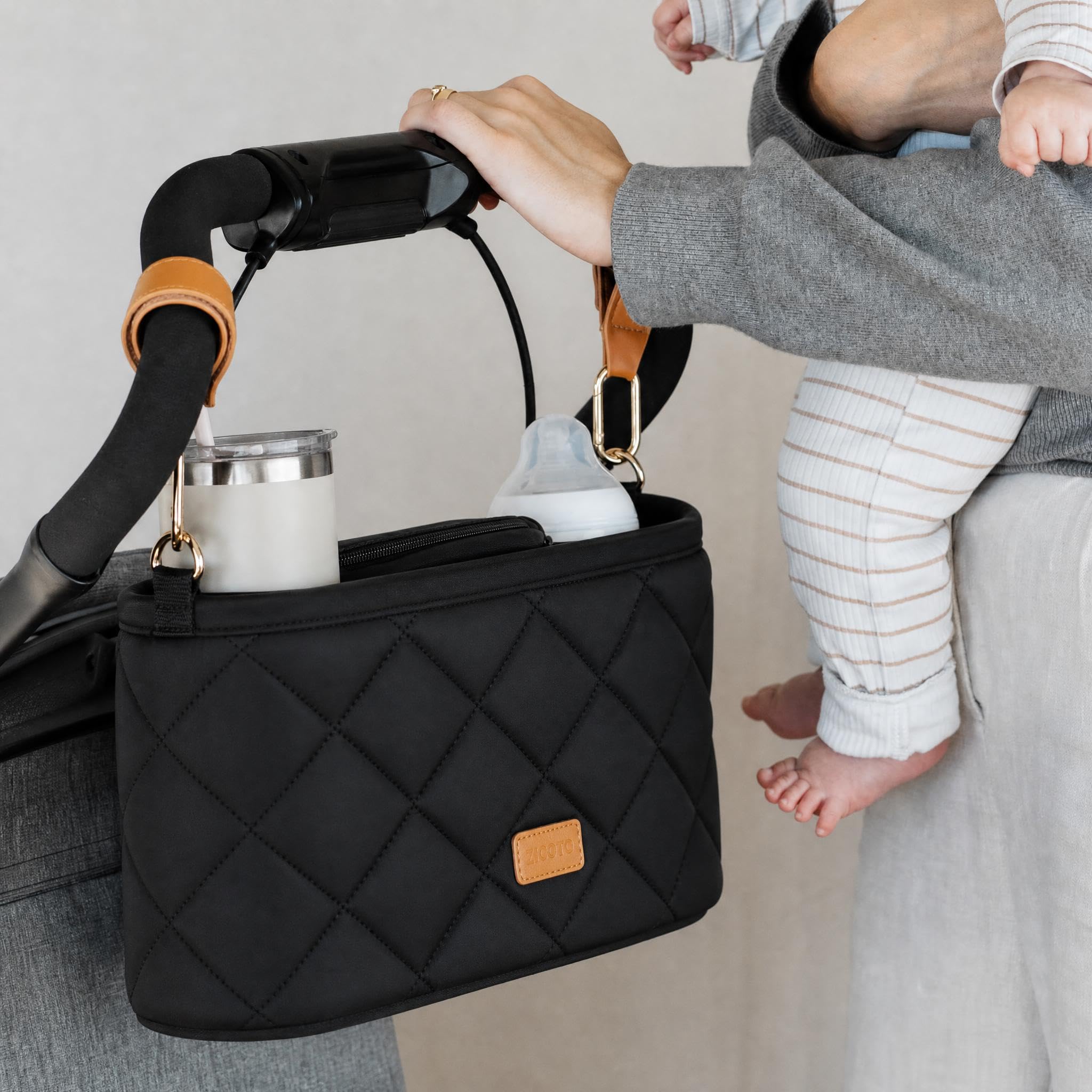 ZICOTO stroller caddy organizer attached to stroller handlebars with two cup holders and zipper pocket